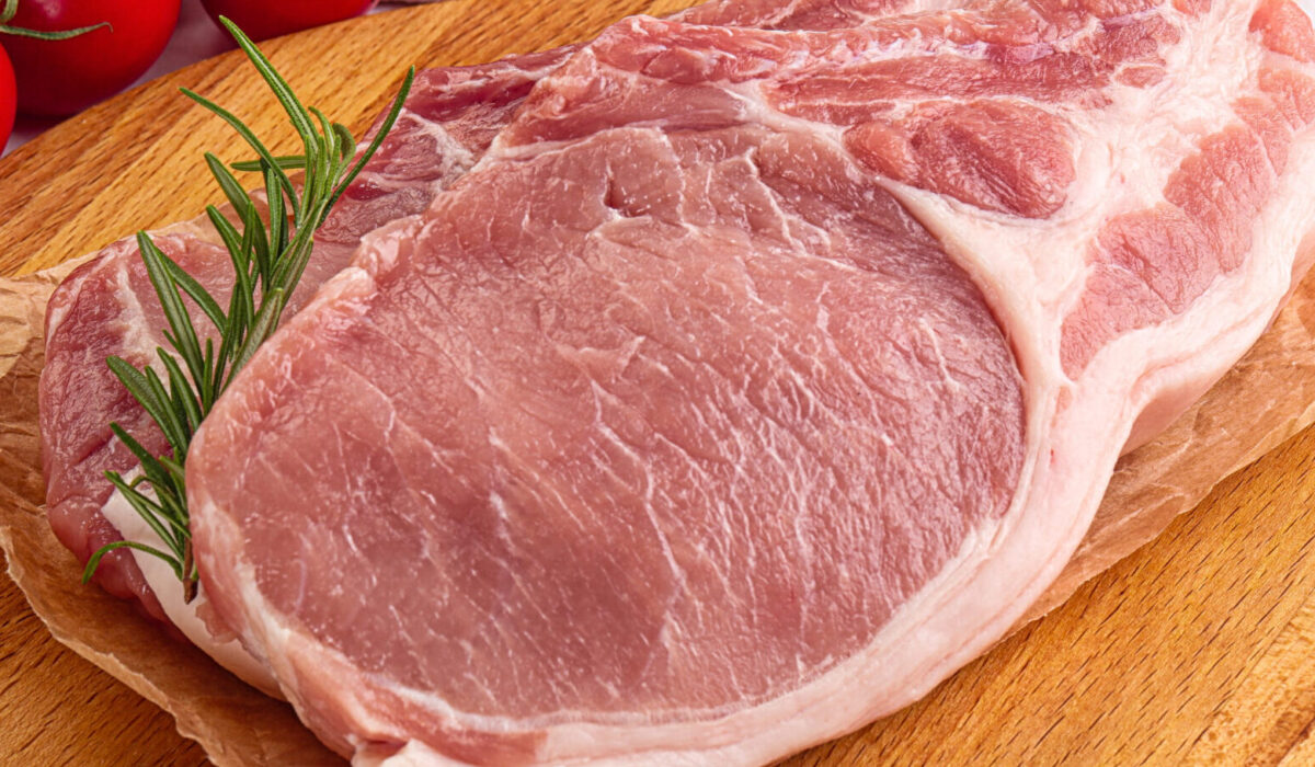 Raw potk loin steak with bone