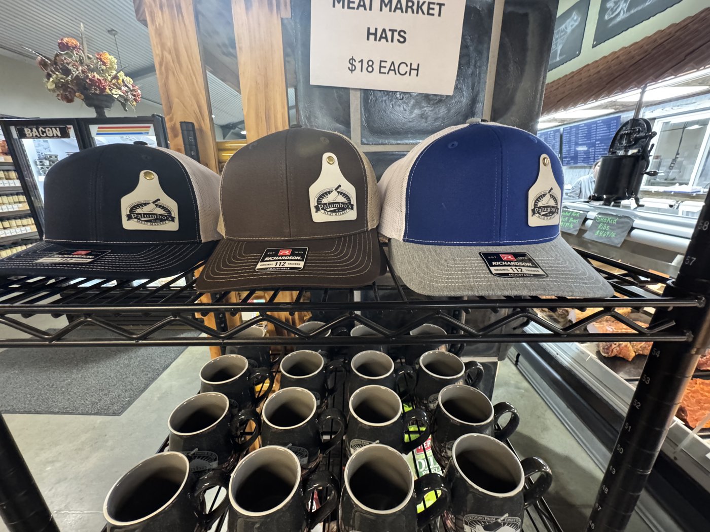 Palumbo’s branded hats and coffee mugs.